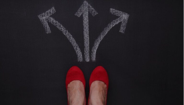 Two feet meeting at the crossroads for choosing the right life insurance