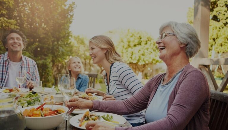 Happy family eating together after finding the right life insurance plan