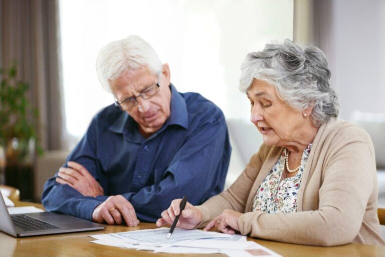 Seniors adjusting their life insurance policy