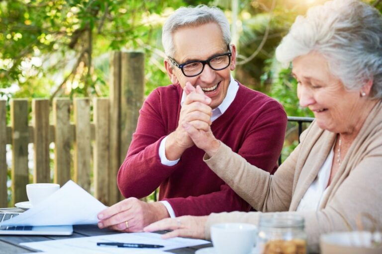 older couple discussing life insurance and retirement