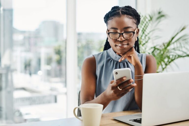 Young woman on laptop reading about supplemental life insurance