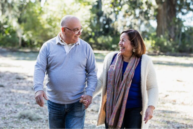 mature couple walking in park