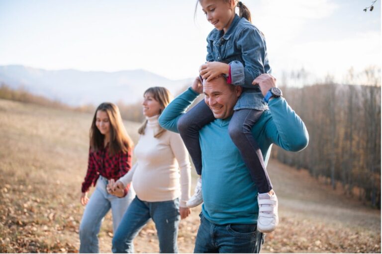 Happy family walking and feeling financially secure because of life insurance proceeds