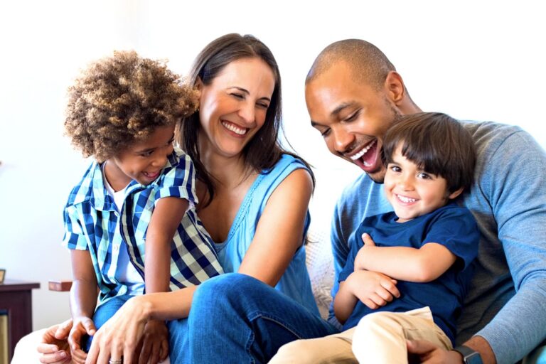 Smiling family protected by essential life insurance riders