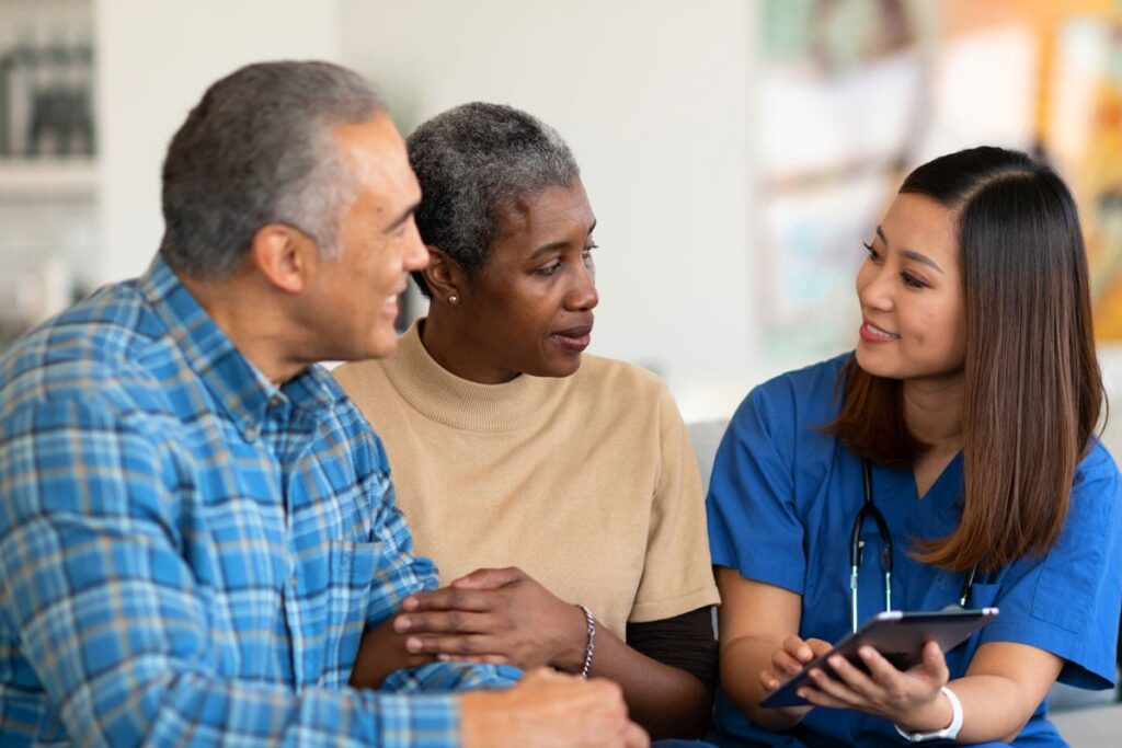 couple having conversation with healthcare professional